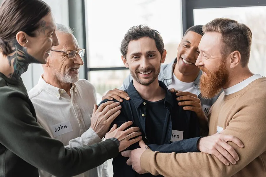 A-circle-of-individuals-sharing-smiles-during-a-group-recovery-meeting