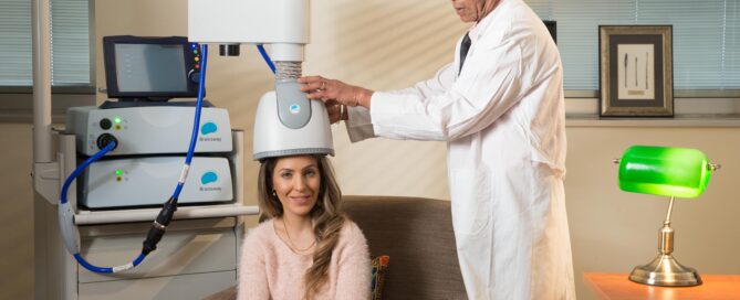 Clinician providing a non-invasive brain stimulation session, illustrating how TMS addiction treatment supports recovery