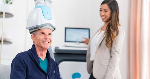 Patient seated comfortably during a guided session focused on TMS therapy for cognitive health